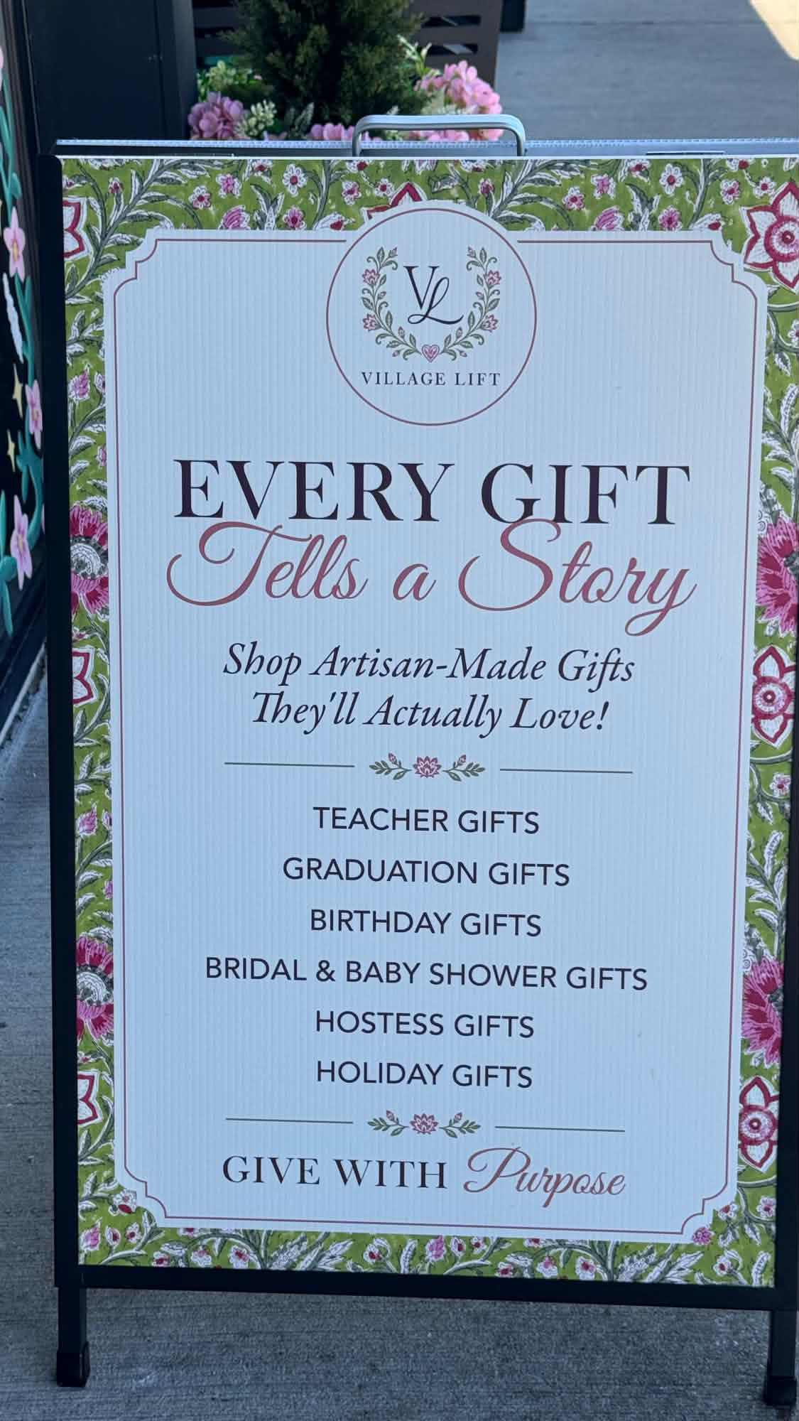 Village Lift sign listing artisan-made gifts for birthdays, holidays, teachers and celebrations