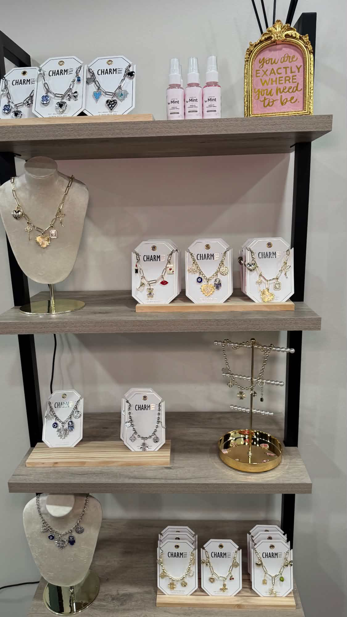 Charm necklaces and permanent-jewelry options displayed at Linked by Mint in Red Bank