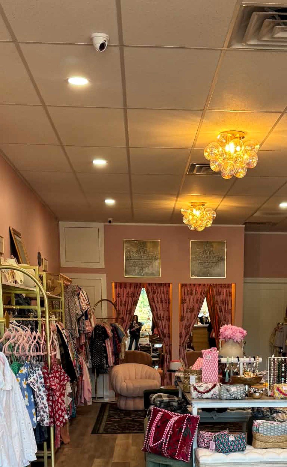 Inside Village Lift in Fair Haven, with colorful clothing, jewelry, bags and gifts on display