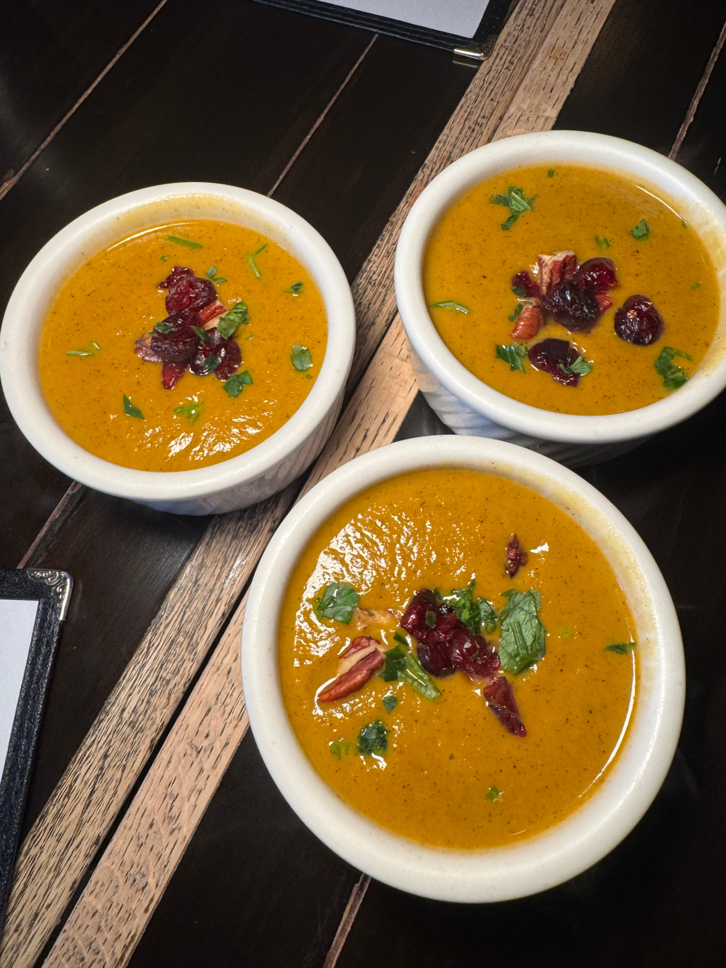 Three bowls of sweet potato bisque at Drew’s Bayshore Bistro