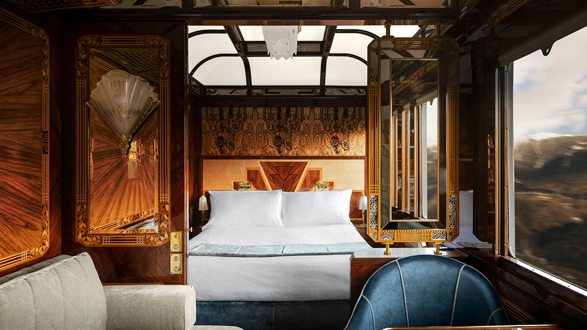 The Paris Grand Suite bedroom and seating area aboard the Venice Simplon-Orient-Express