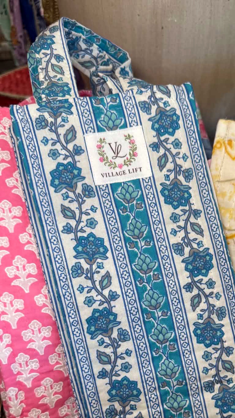 Colorful hand block-printed quilted totes at Village Lift in Fair Haven
