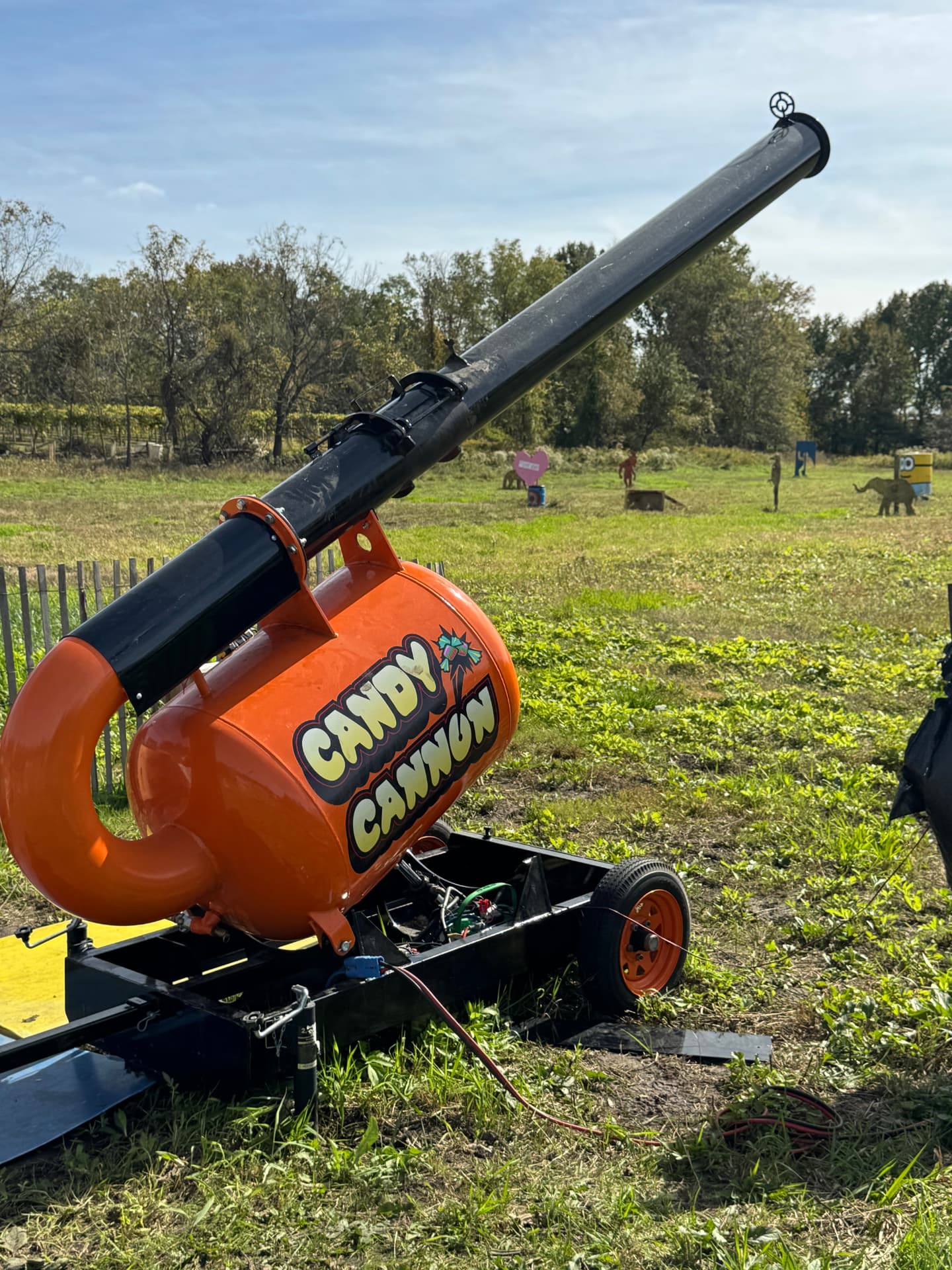 An orange machine labeled Candy Cannon photographed during Jennifer’s fall outing